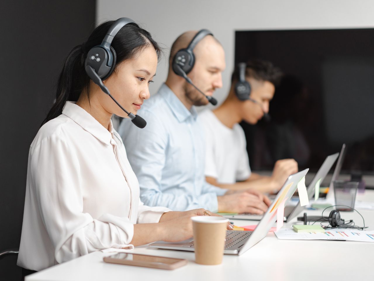 people in an office with headset