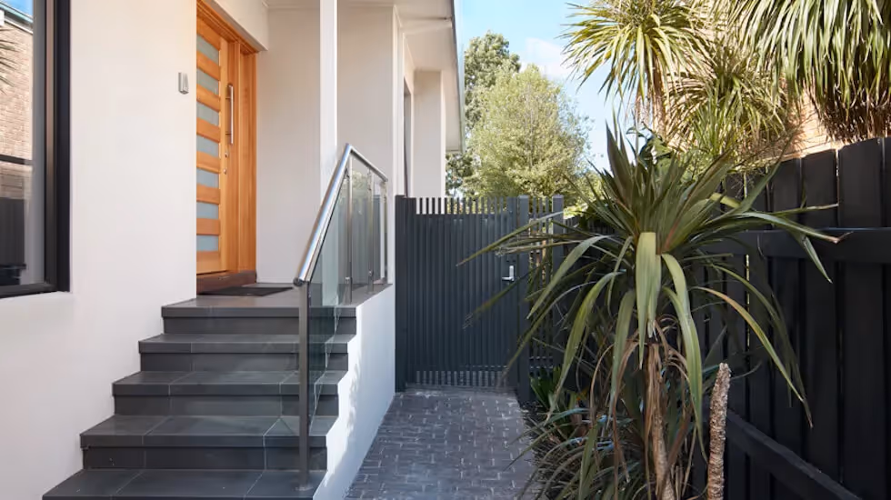 Modern home entryway with sidegate access