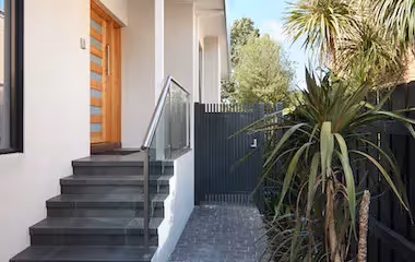 Modern home entryway with sidegate access