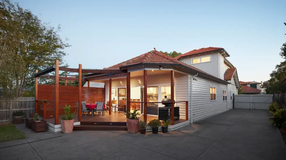 Home extension with timber deck and pergola.