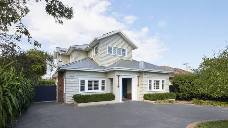 Two-storey house extension in Melbourne requiring building permits and council approval.