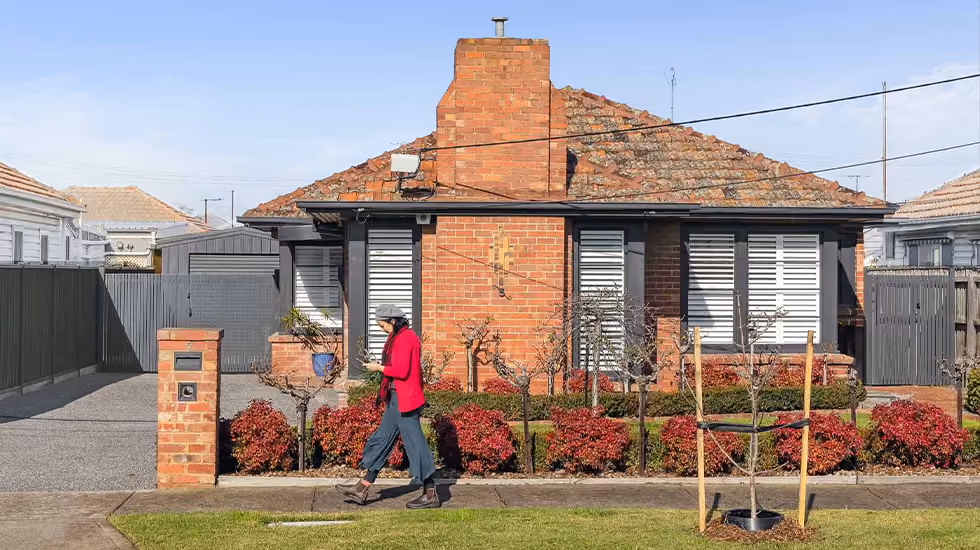 Outside view of an Art Deco house that’s been extended and renovated.