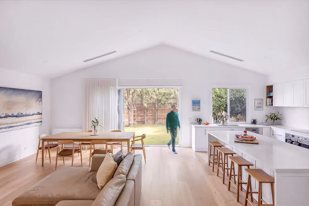 Contemporary open-plan kitchen and dining area created through a modern home extension.
