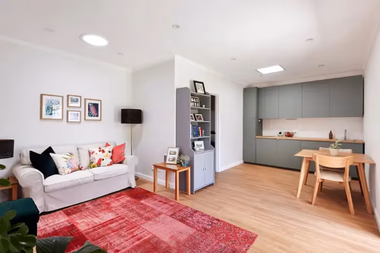 Spacious open-plan living and dining area with modern finishes after a home extension.