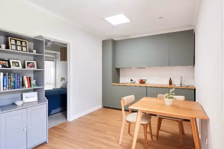 Modern home extension with open-plan kitchen, dining area and built-in storage in Melbourne