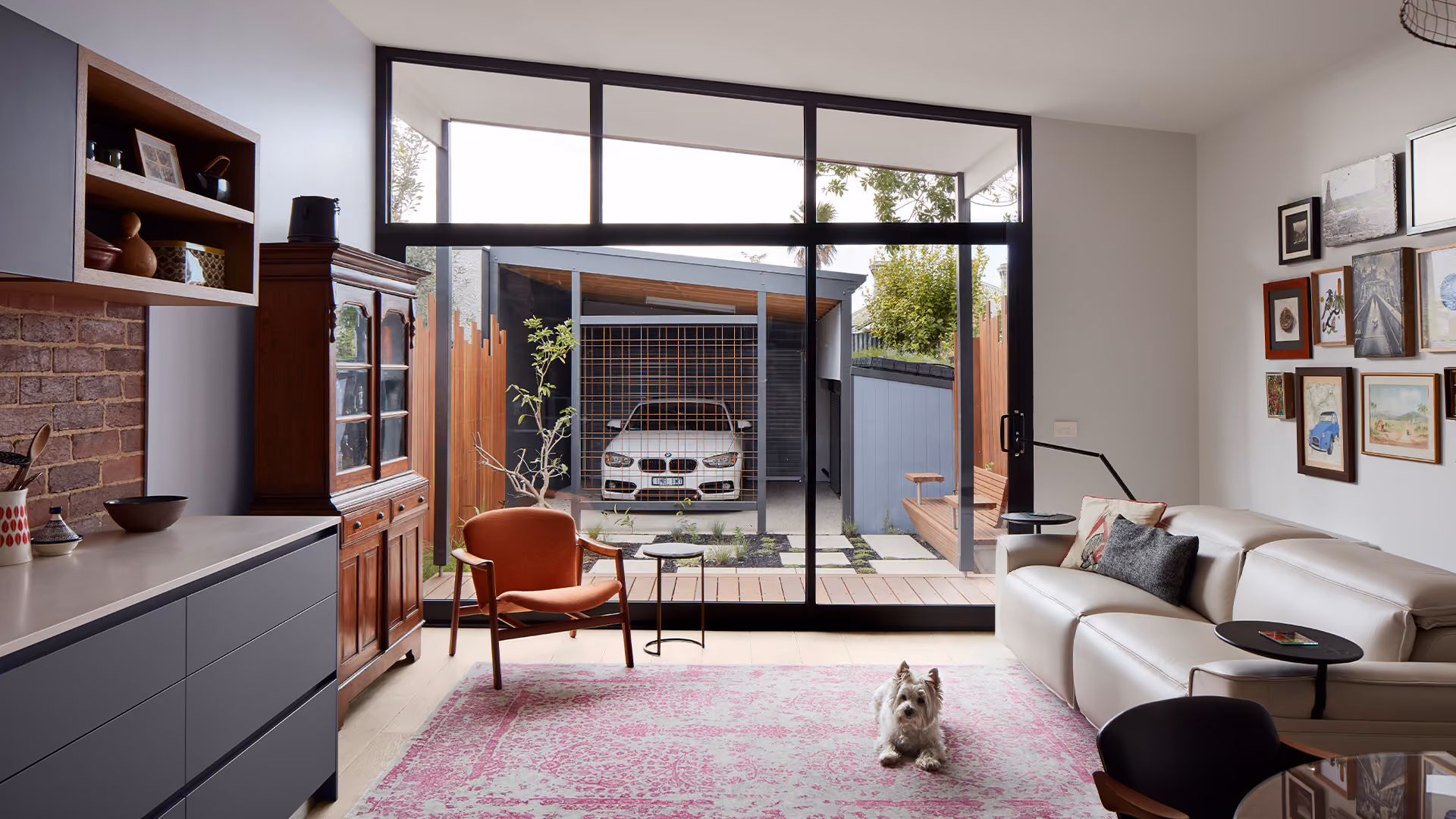 Bright open-plan living room connected to a contemporary home extension overlooking the outdoor courtyard.