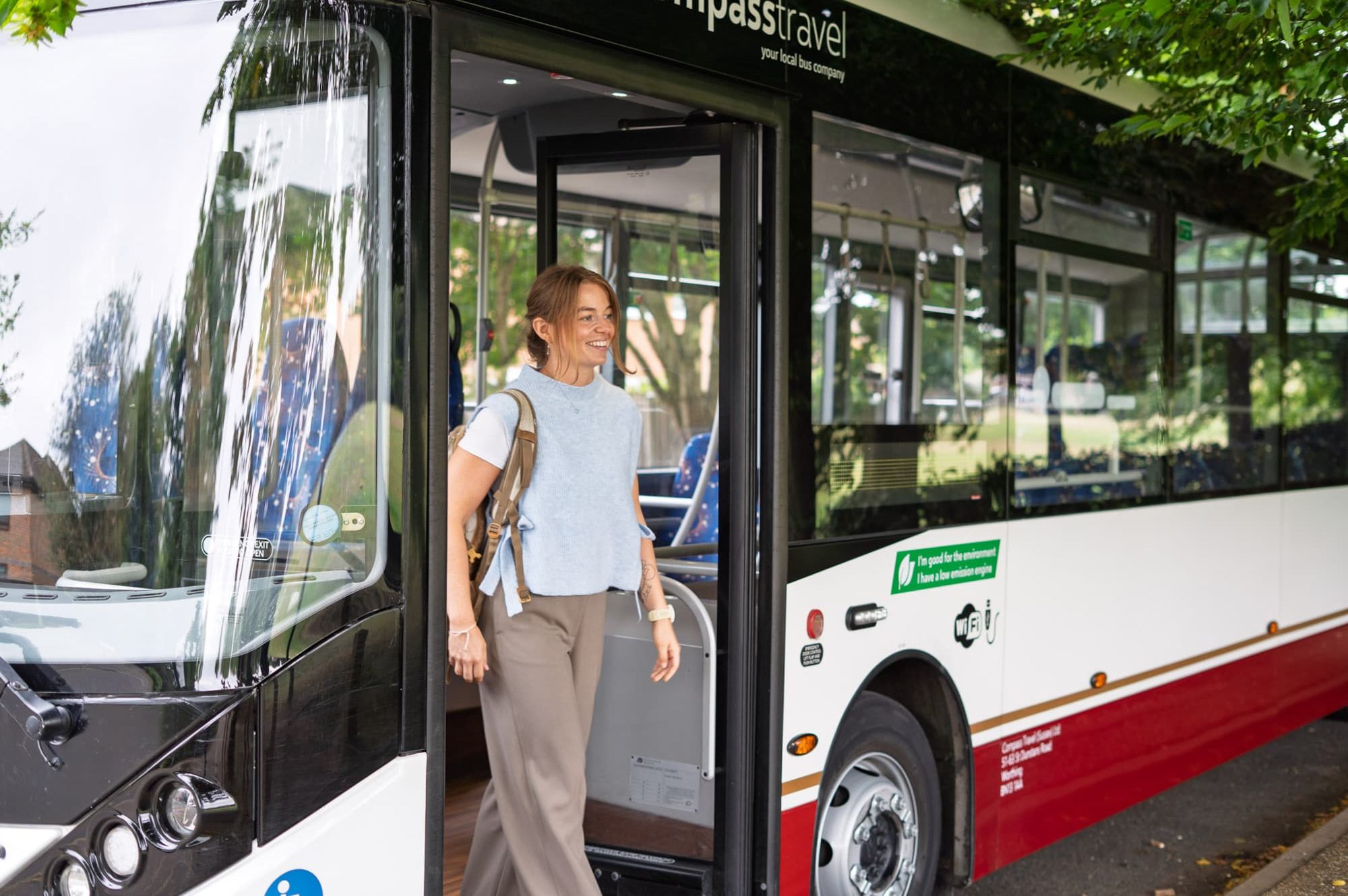 Woman waiting on bus.