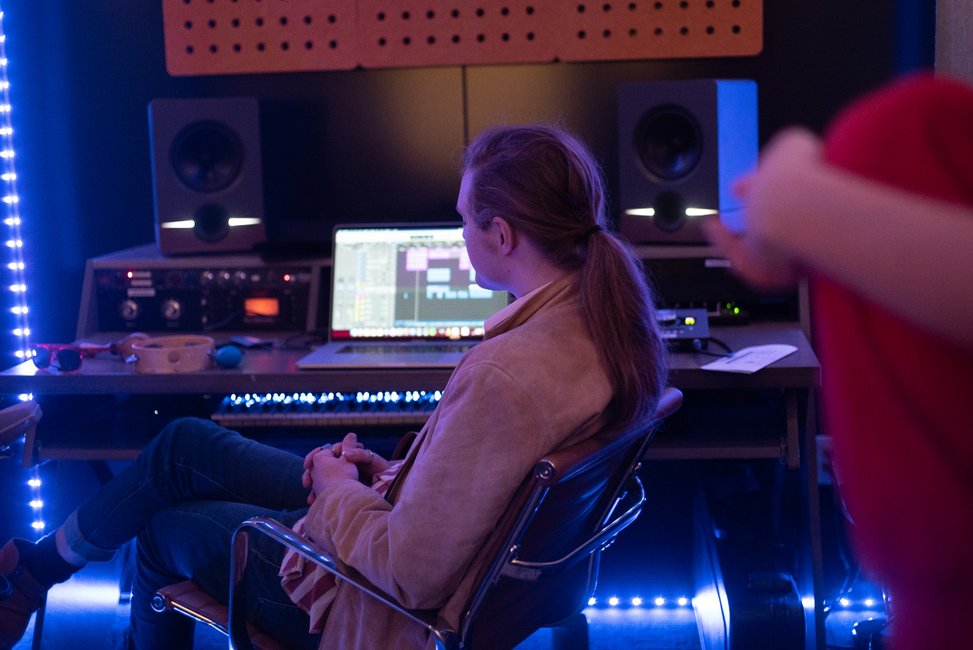 A student seen from behind, focused intently while producing music in a high-end recording studio at LAAMP. The image highlights the program’s professional-grade studio environment and hands-on learning approach. It reflects the quality of work students are immersed in daily, as they apply real-world techniques taught through a rigorous, mentorship-driven curriculum designed to elevate their creative and technical skills in music production.
