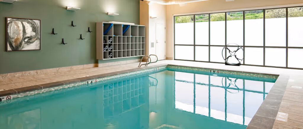1-Bedroom Apartments in Tacoma, WA - Point Ruston - Heated Indoor Pool with Cubbyholes for Storage and Frosted-Glass Window Wall.