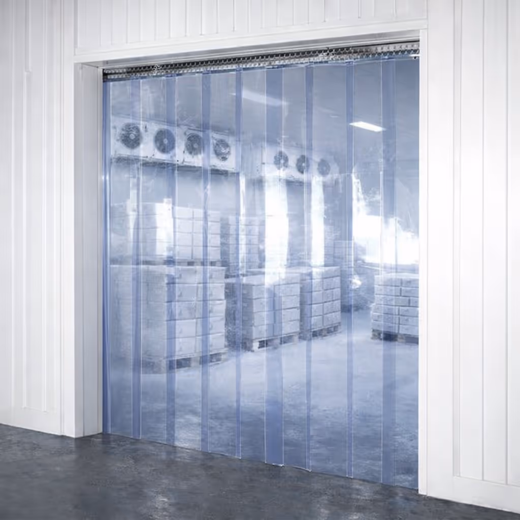 Entrance to a cold storage room with clear plastic strip curtains and stacks of palletized boxes inside.