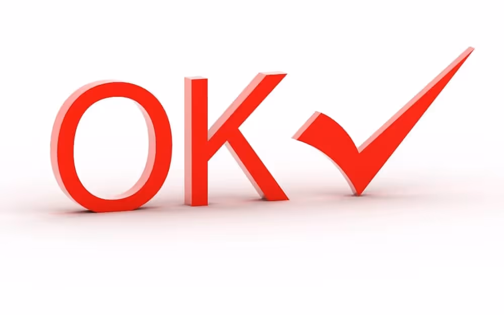 Infographie 'ok' avec mot 'ok' écrit en rouge avec effet 3D sur fond blanc