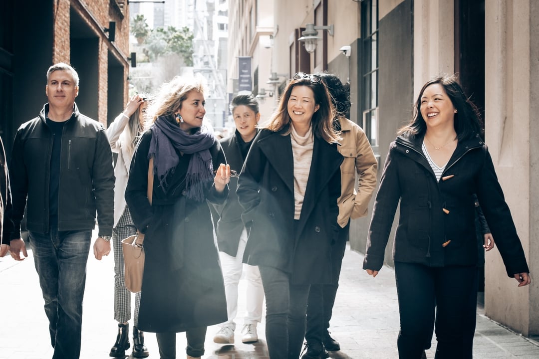 team walking through alley