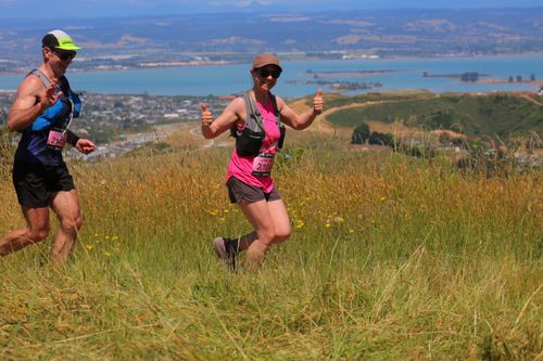 reverends emily and greg holmes run a marathon together