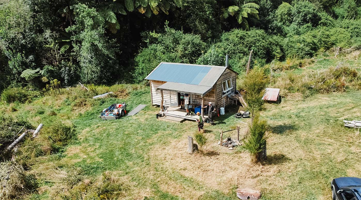 a bird's eye view of Ruru cabin on Mamaku Grove farmland