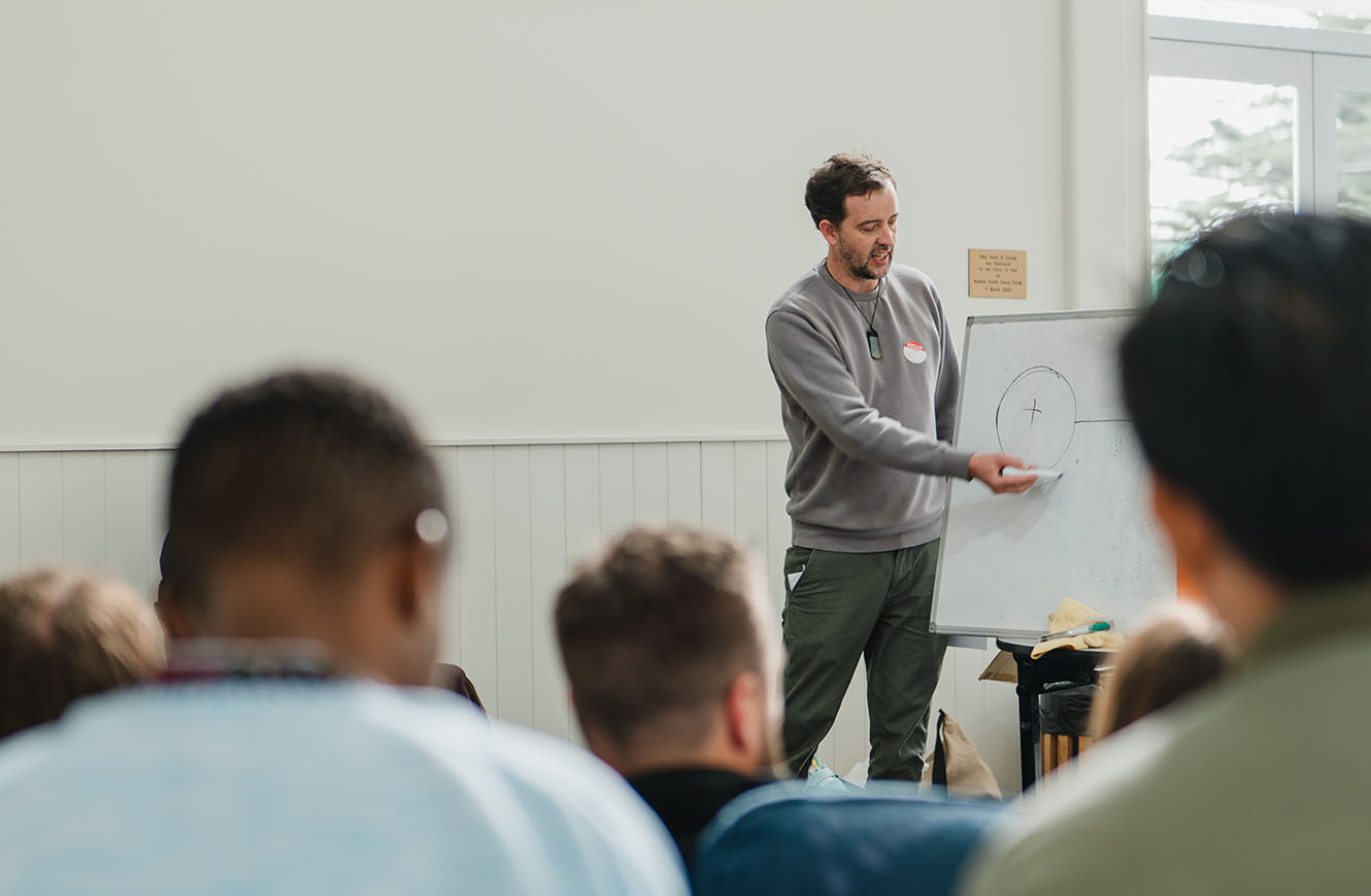 Jason Shaw presenting at a whiteboard