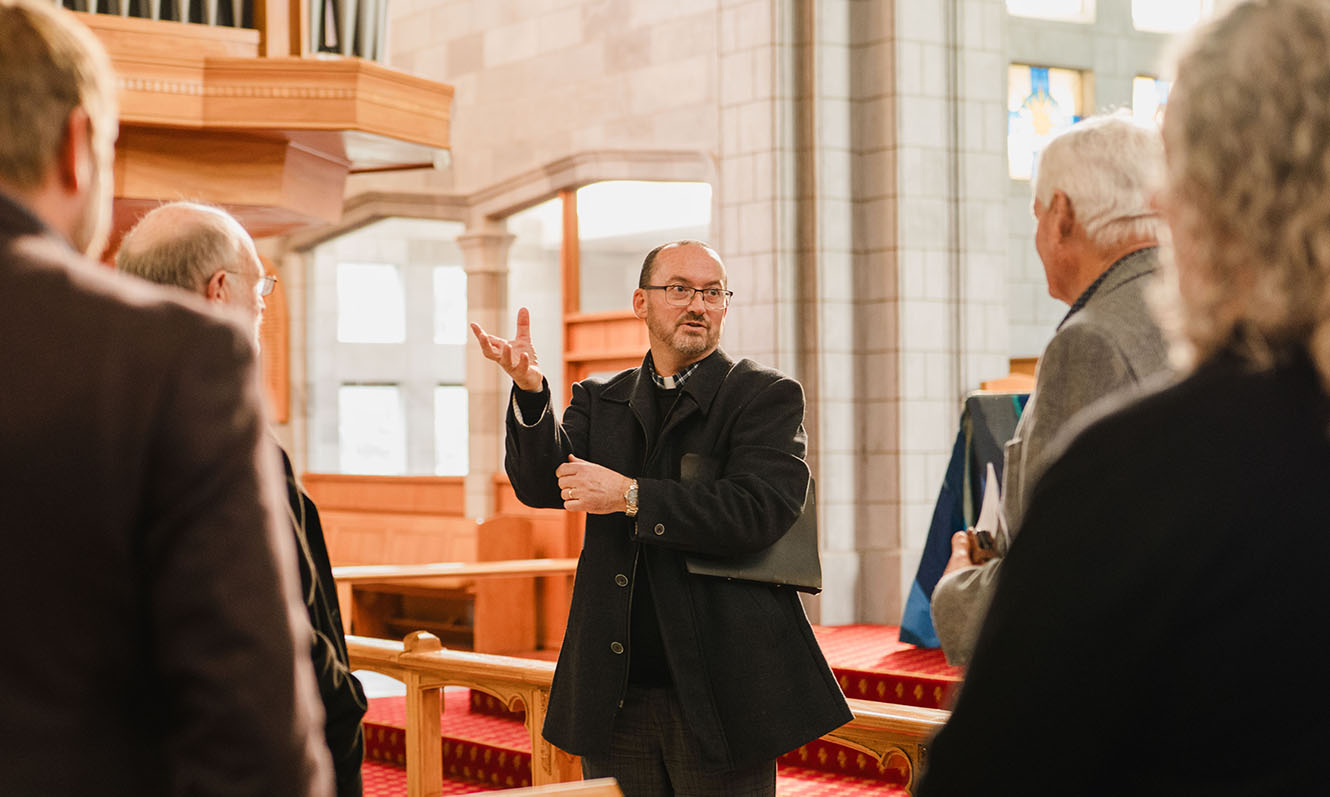 Cathedral Dean Graham O'Brien giving a tour of the cathedral
