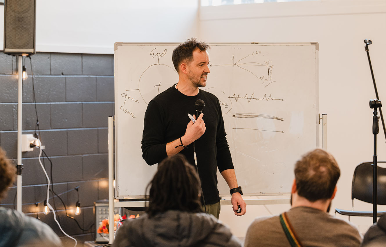 Jason Shaw leading a workshop in front of a whiteboard