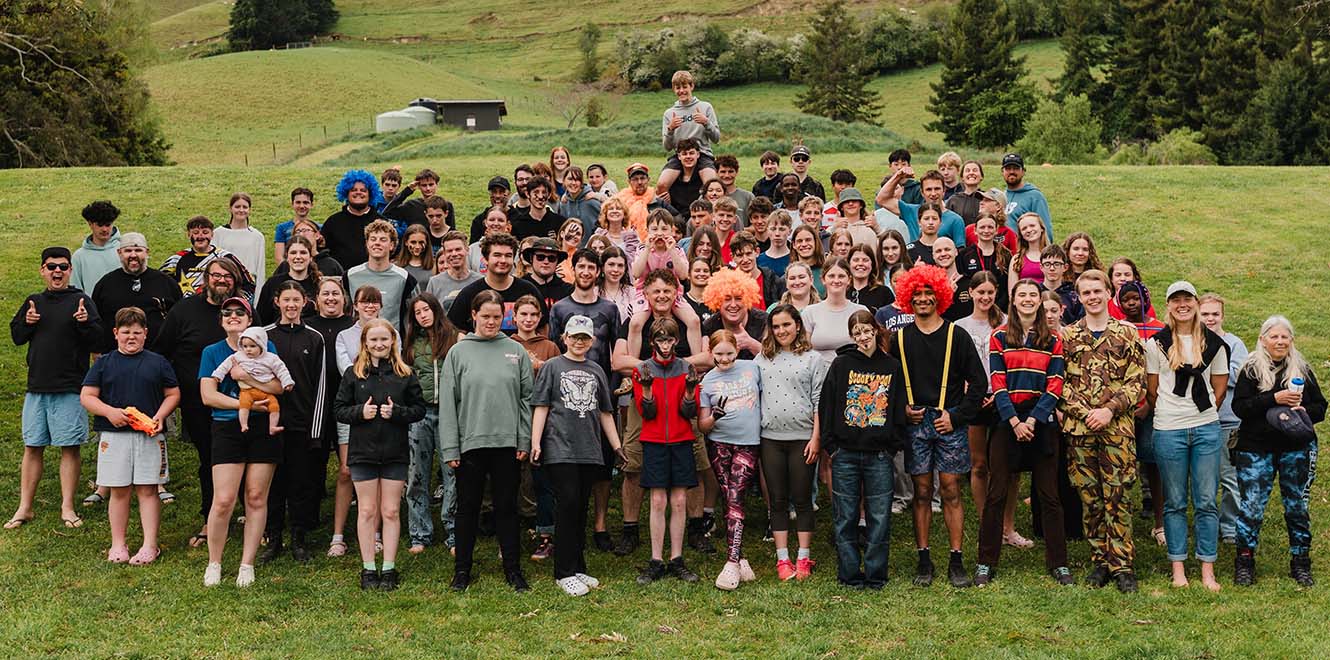 Campers of Spring Camp 2025 on a grassy hill