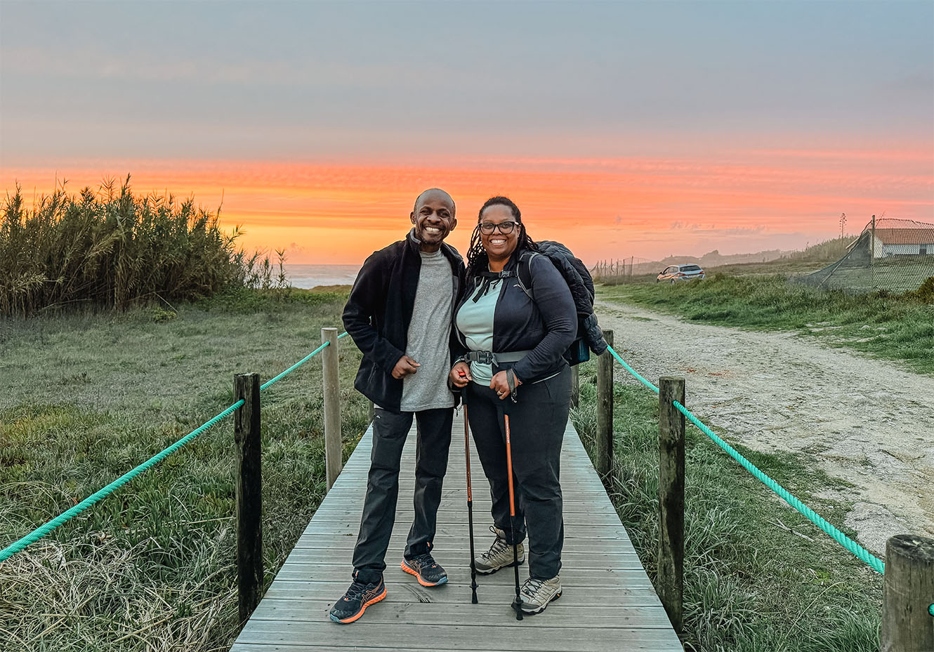 Bishop Steve and Watiri in Vila do Conde with a bright sunset behind them