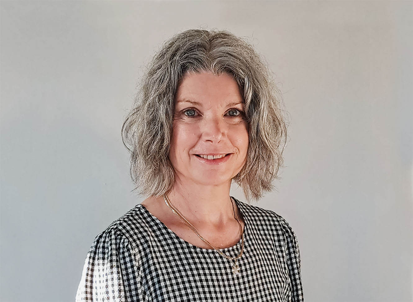 A headshot of Donna