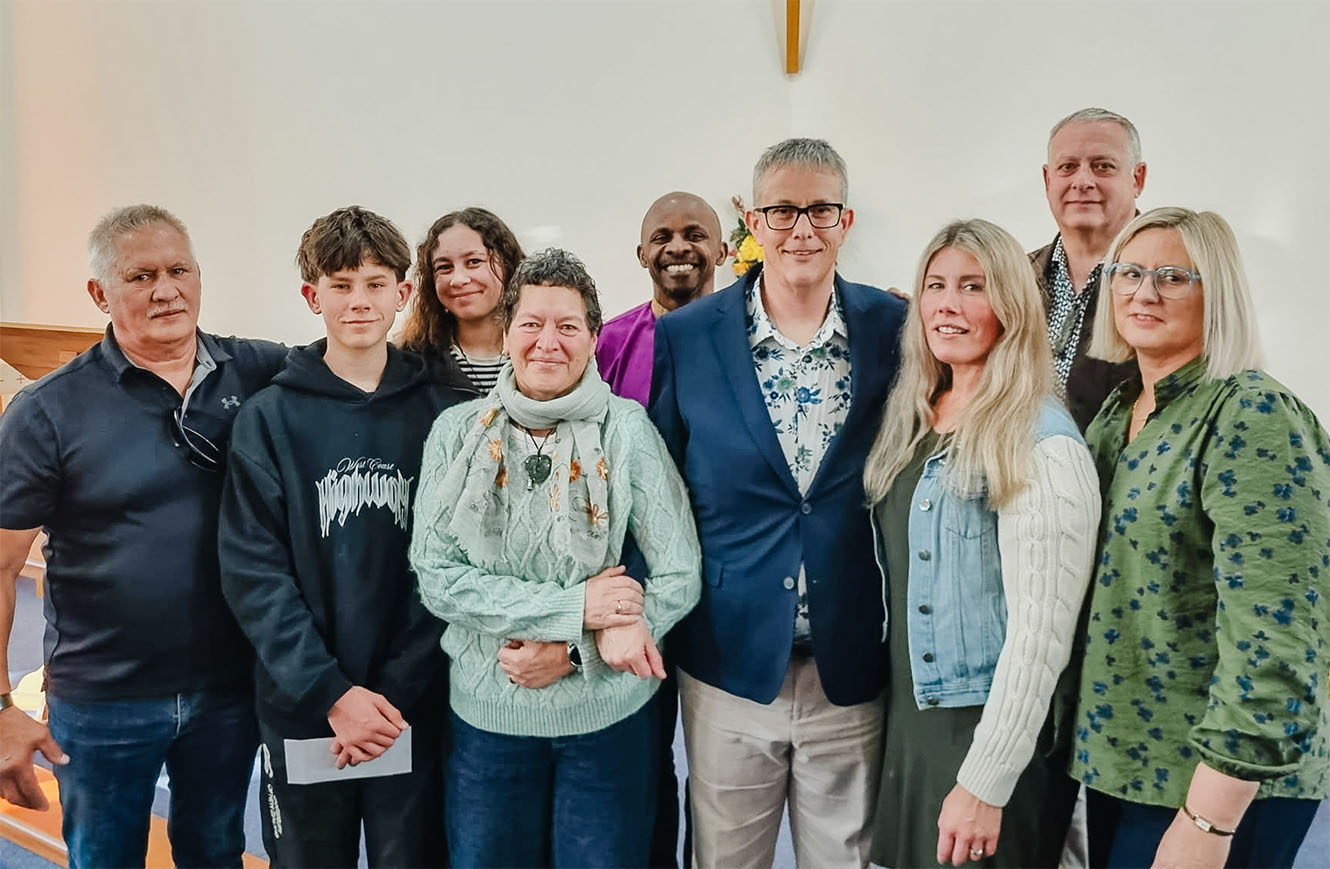 Nigel Irwin surrounded by family and members of St Christopher's
