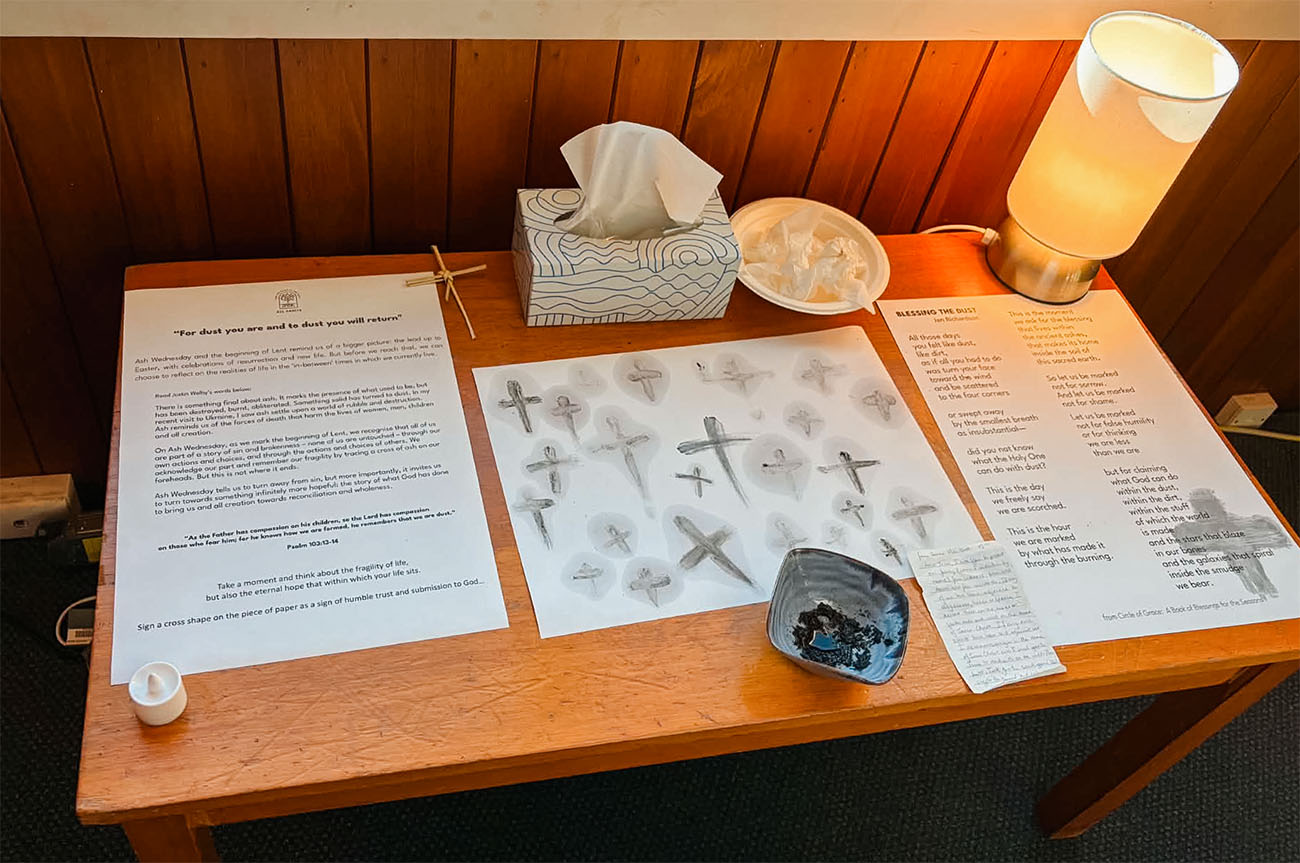 A reflective station with a bowl of ashes to draw crosses with at All Saints
