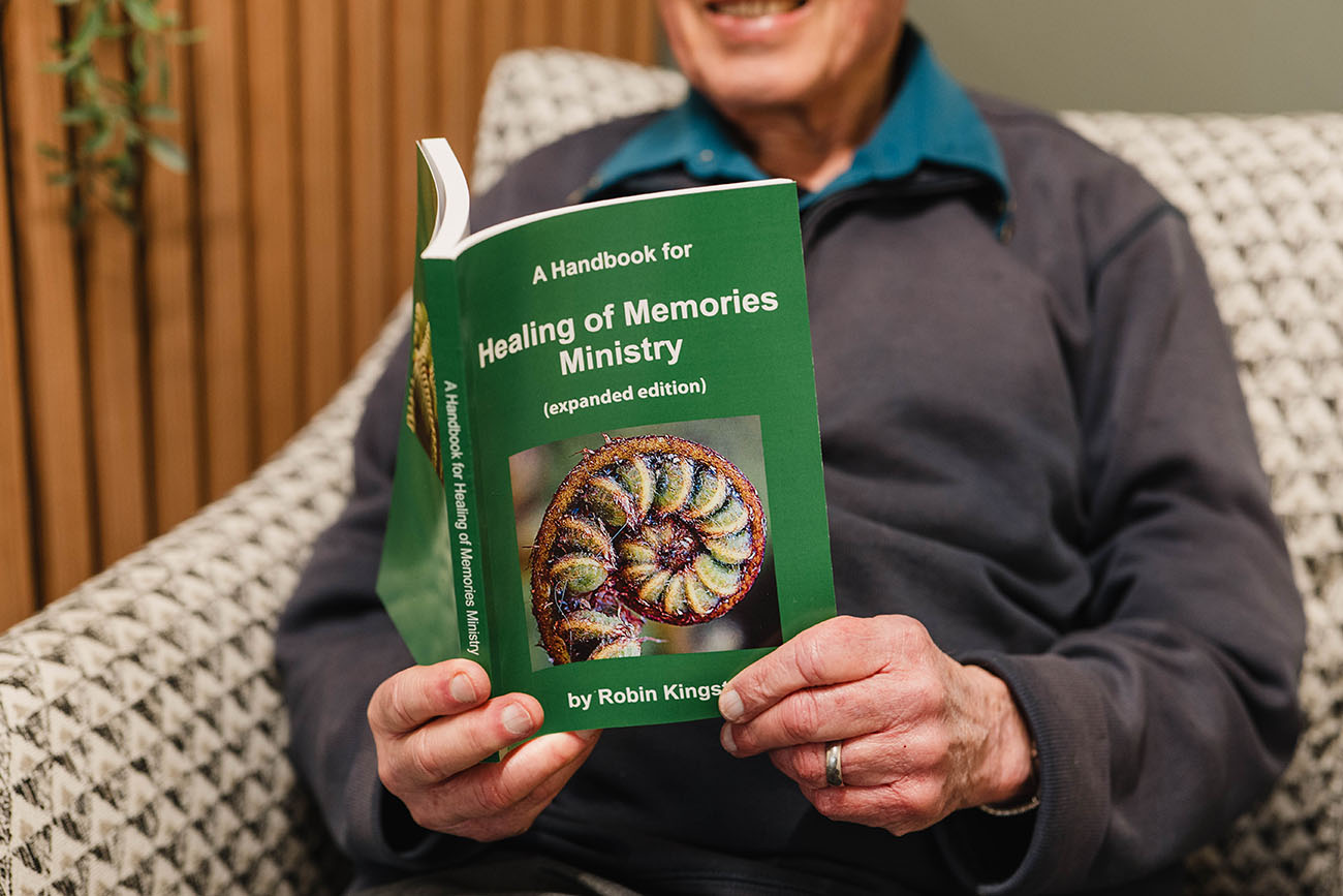 Robin Kingston holds A Handbook for Healing of Memories Ministry