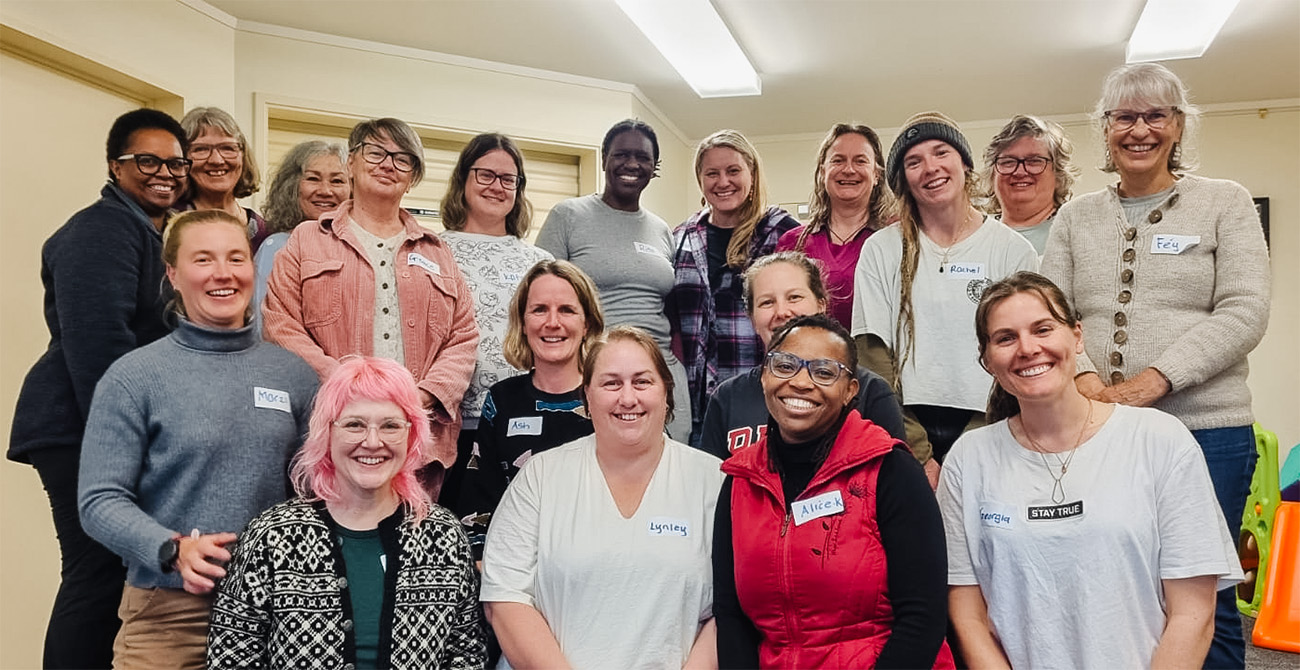 a group of women gathered for a photo
