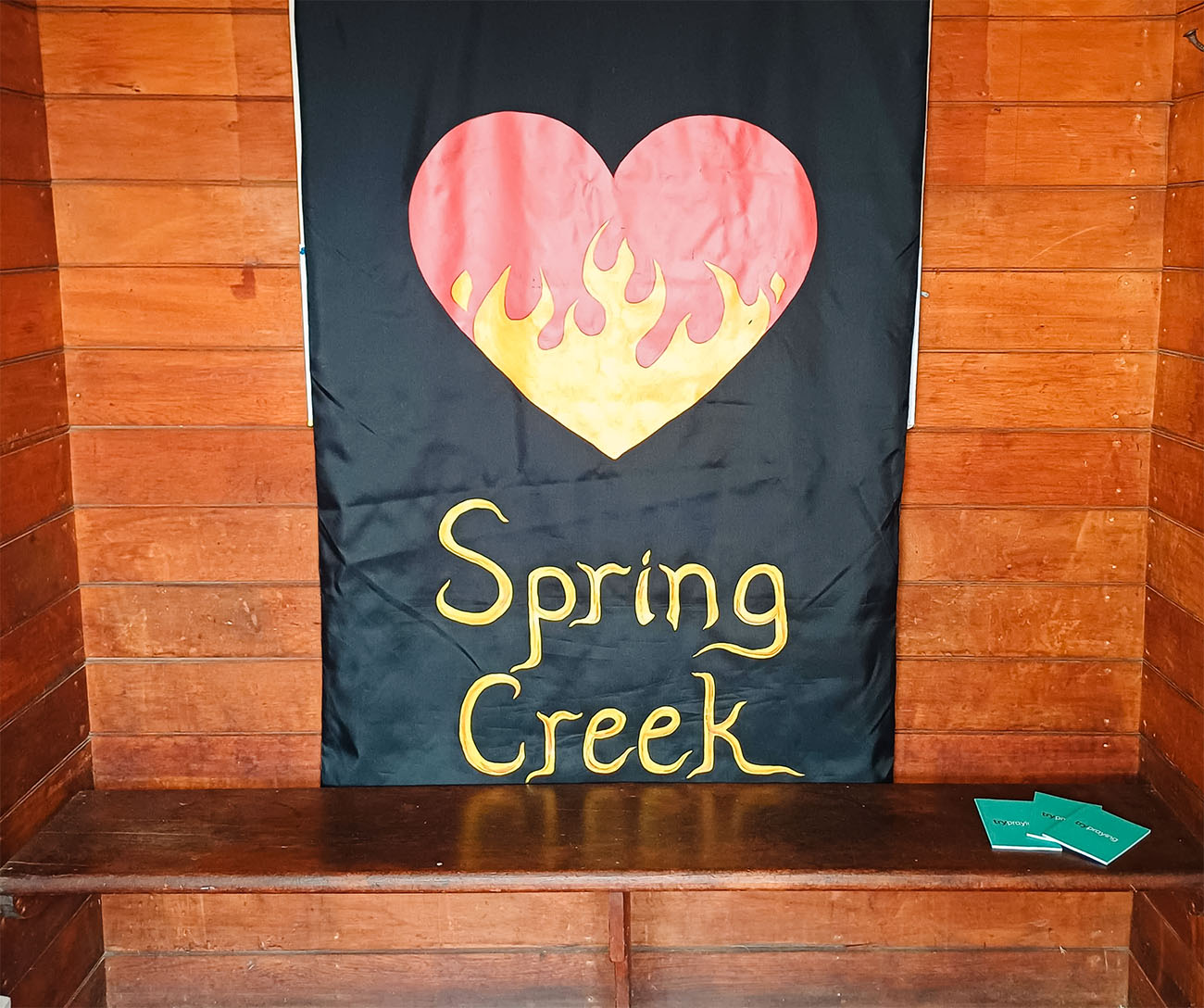 a banner in the St Luke's foyer with a fiery heart and the words "Spring Creek"