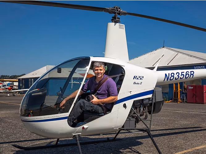 Francis Zera in a small helicpoter