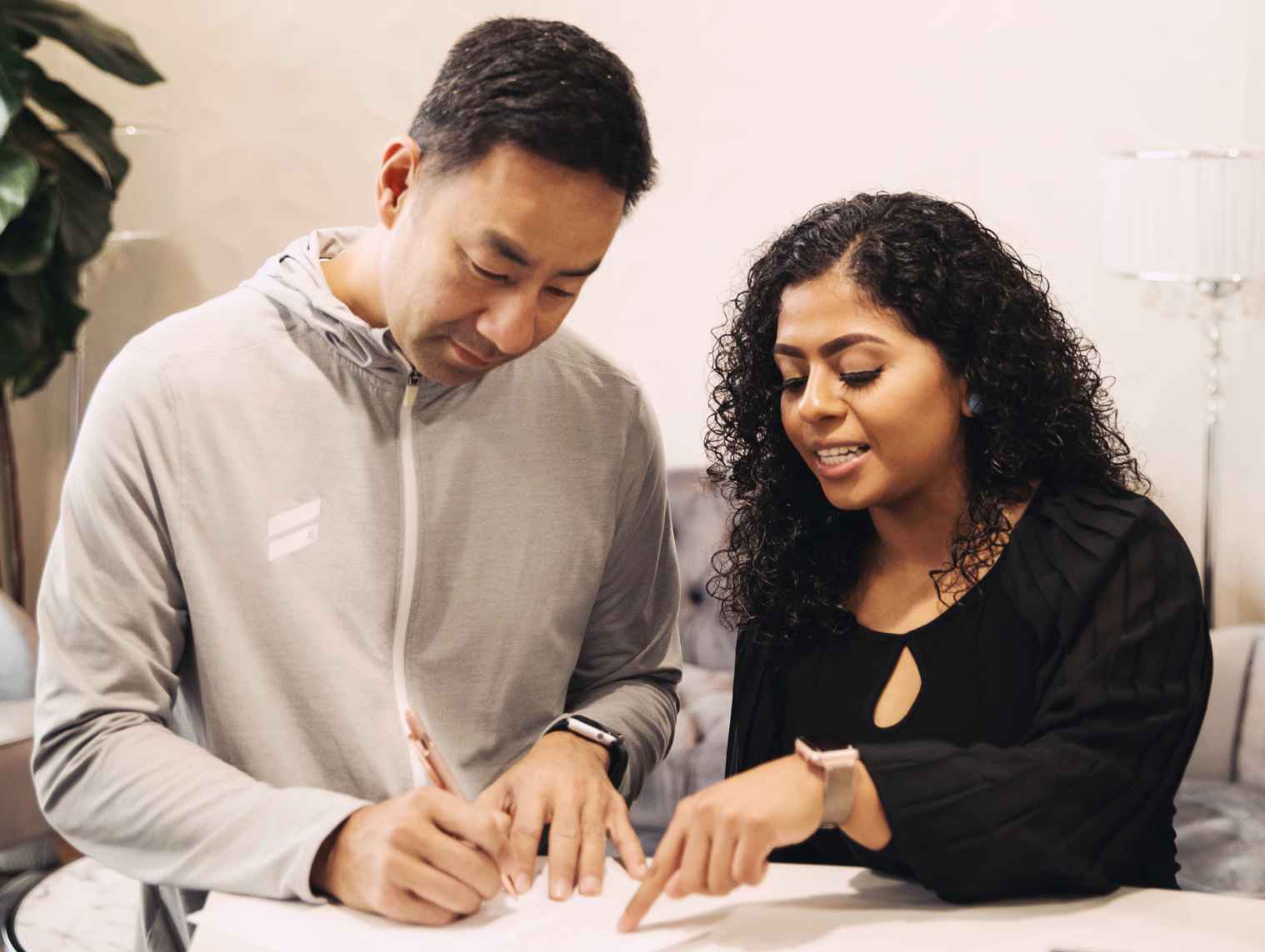 Dr. Nguyen sitting at a consultation table talking with a patient