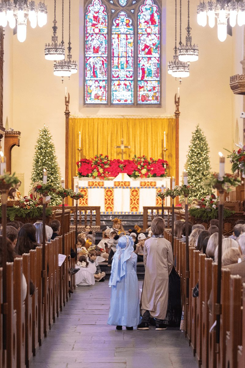 Interior of a church during a Christmas pageant.