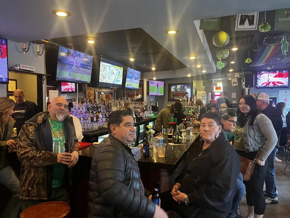 River Grove Lions Club members posing together in festive St. Patrick's Day attire