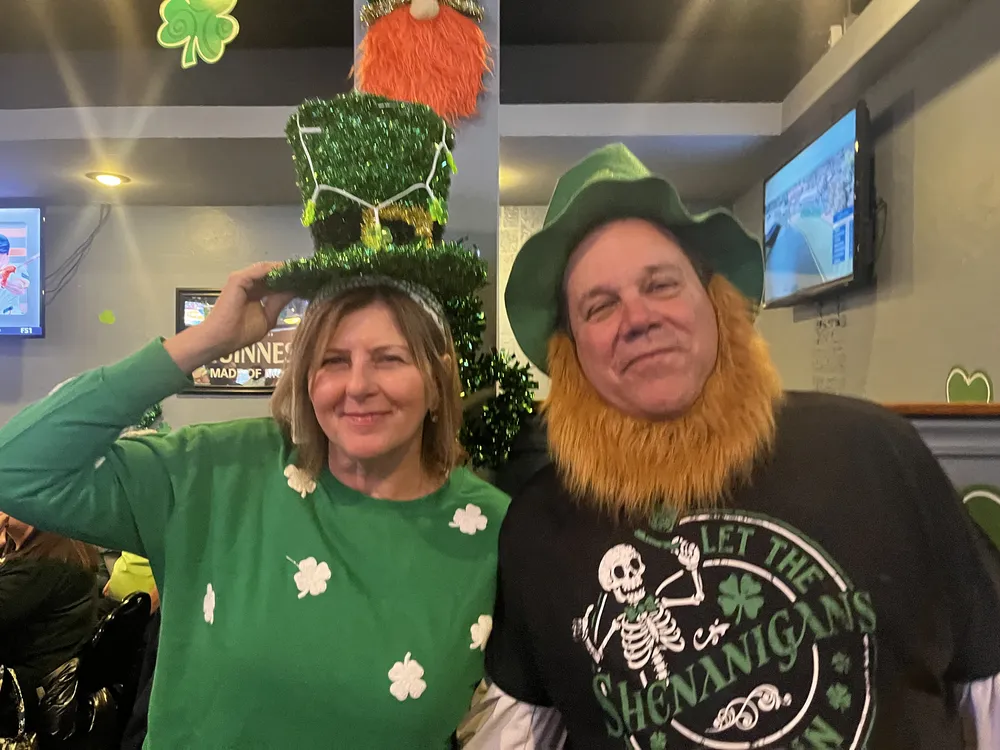 River Grove Lions Club members smiling together at the St. Patrick's Day dinner at the Underpass Lounge