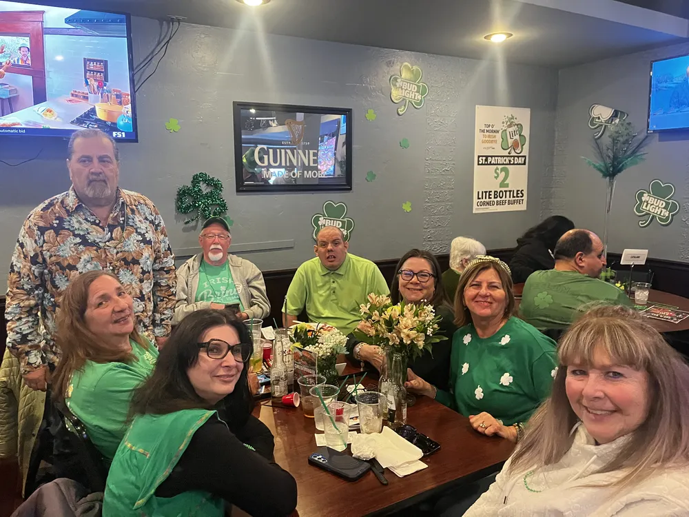 River Grove Lions Club members wearing green celebrating St. Patrick's Day at the Underpass Lounge