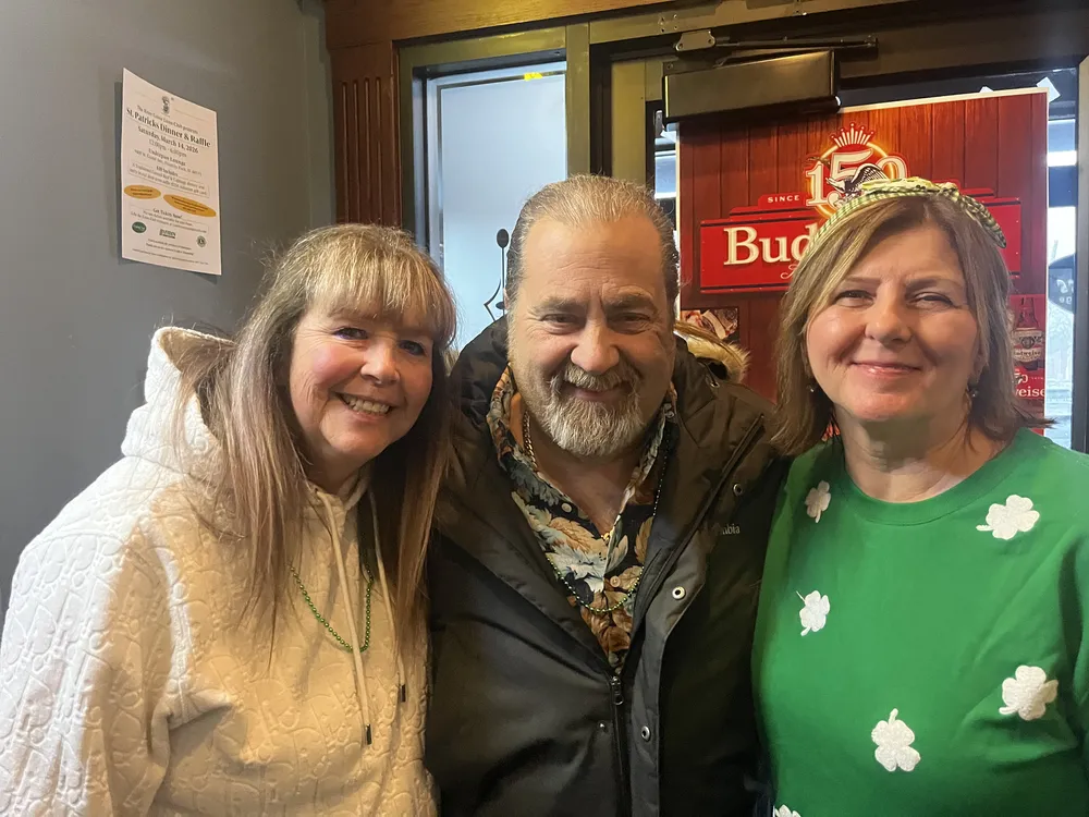 River Grove Lions Club members laughing and enjoying the St. Patrick's Day fundraiser dinner at the Underpass Lounge