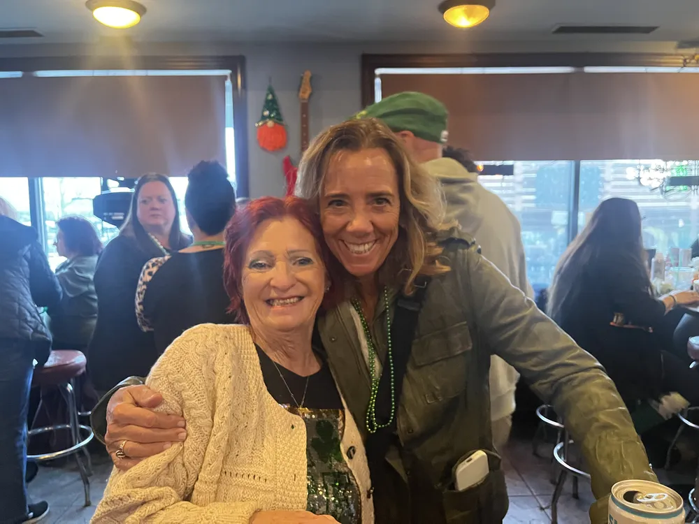 River Grove Lions Club members wearing green and smiling during the St. Patrick's Day dinner and raffle