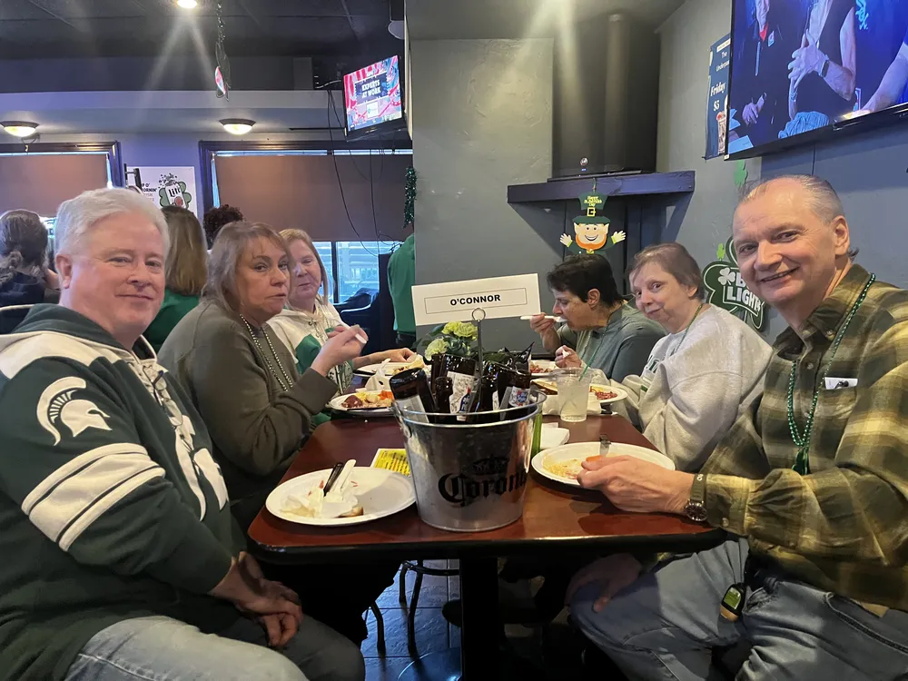River Grove Lions Club members posing for a photo at the St. Patrick's Day dinner and raffle event