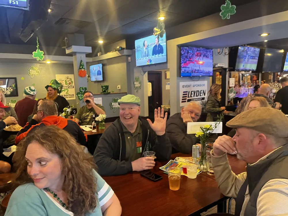 River Grove Lions Club members smiling and enjoying the St. Patrick's Day dinner celebration