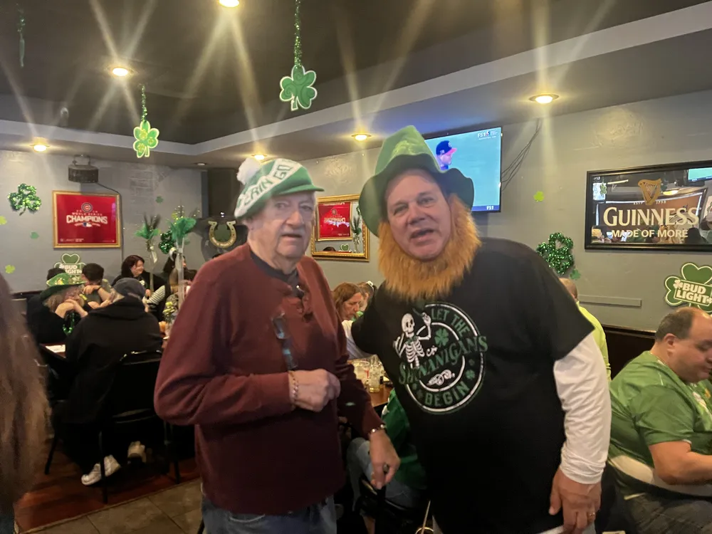 River Grove Lions Club members seated at a dinner table during the St. Patrick's Day event