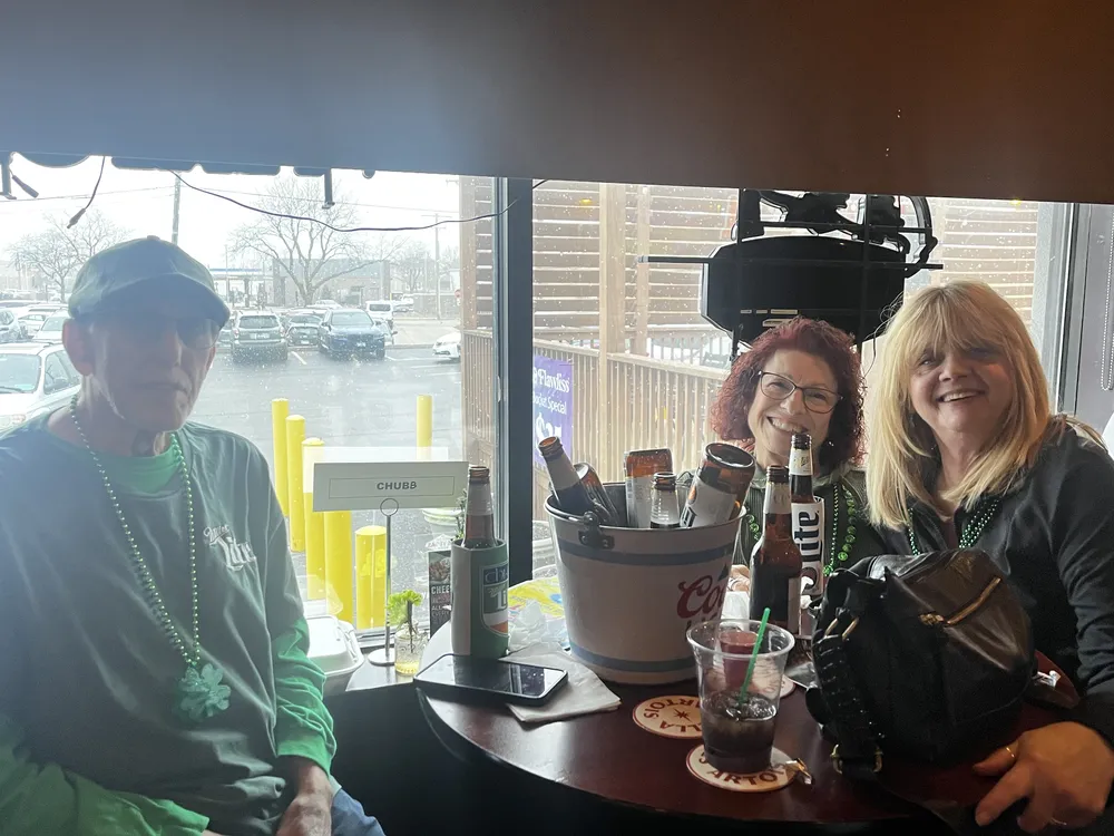 River Grove Lions Club members enjoying food and conversation at the St. Patrick's Day fundraiser dinner
