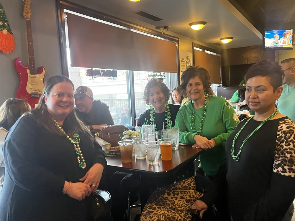 River Grove Lions Club members in green attire gathered for the St. Patrick's Day dinner and raffle