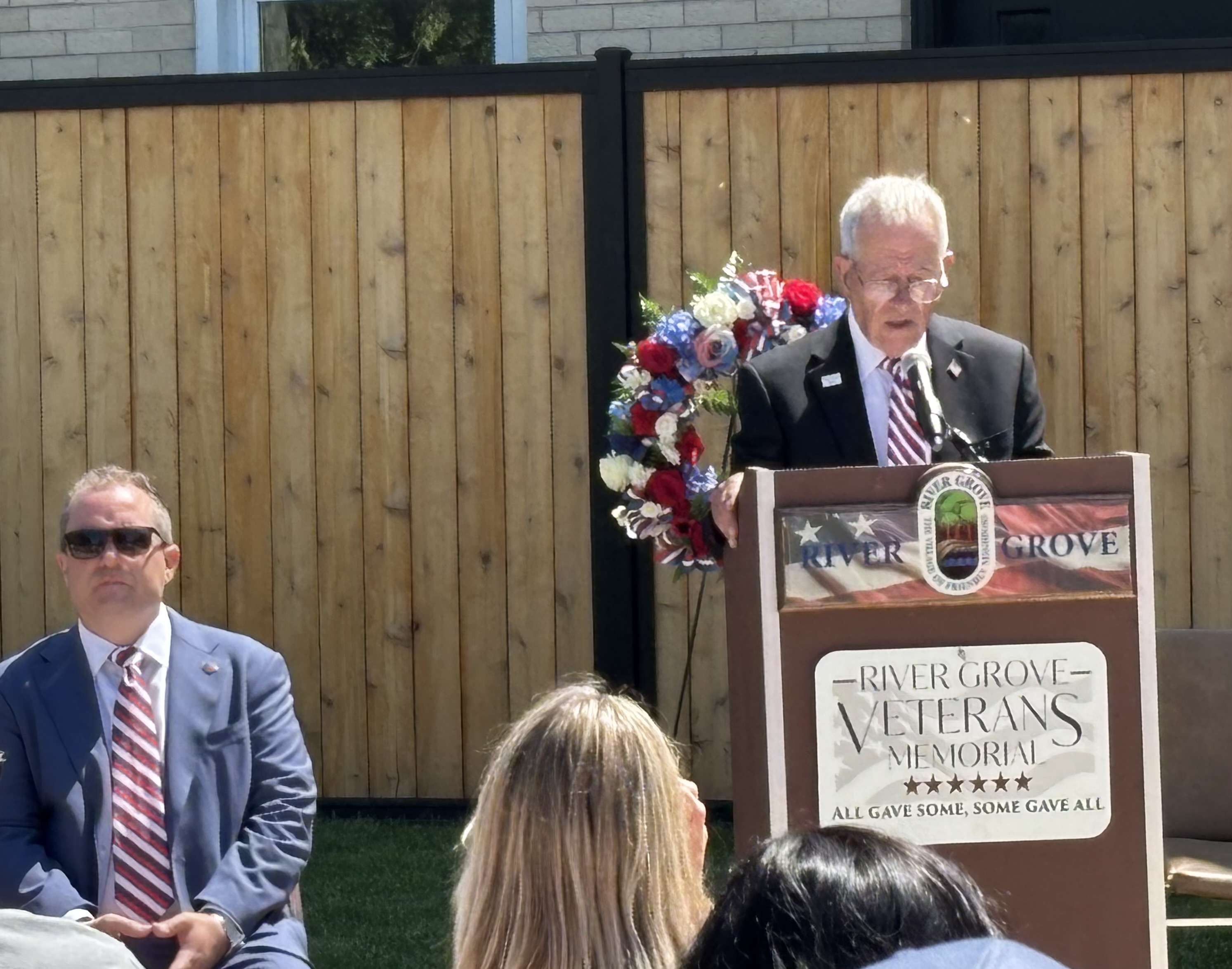 River Grove Lions Club members and community gather at the Veterans Memorial during the 2026 Memorial Day ceremony in River Grove, IL