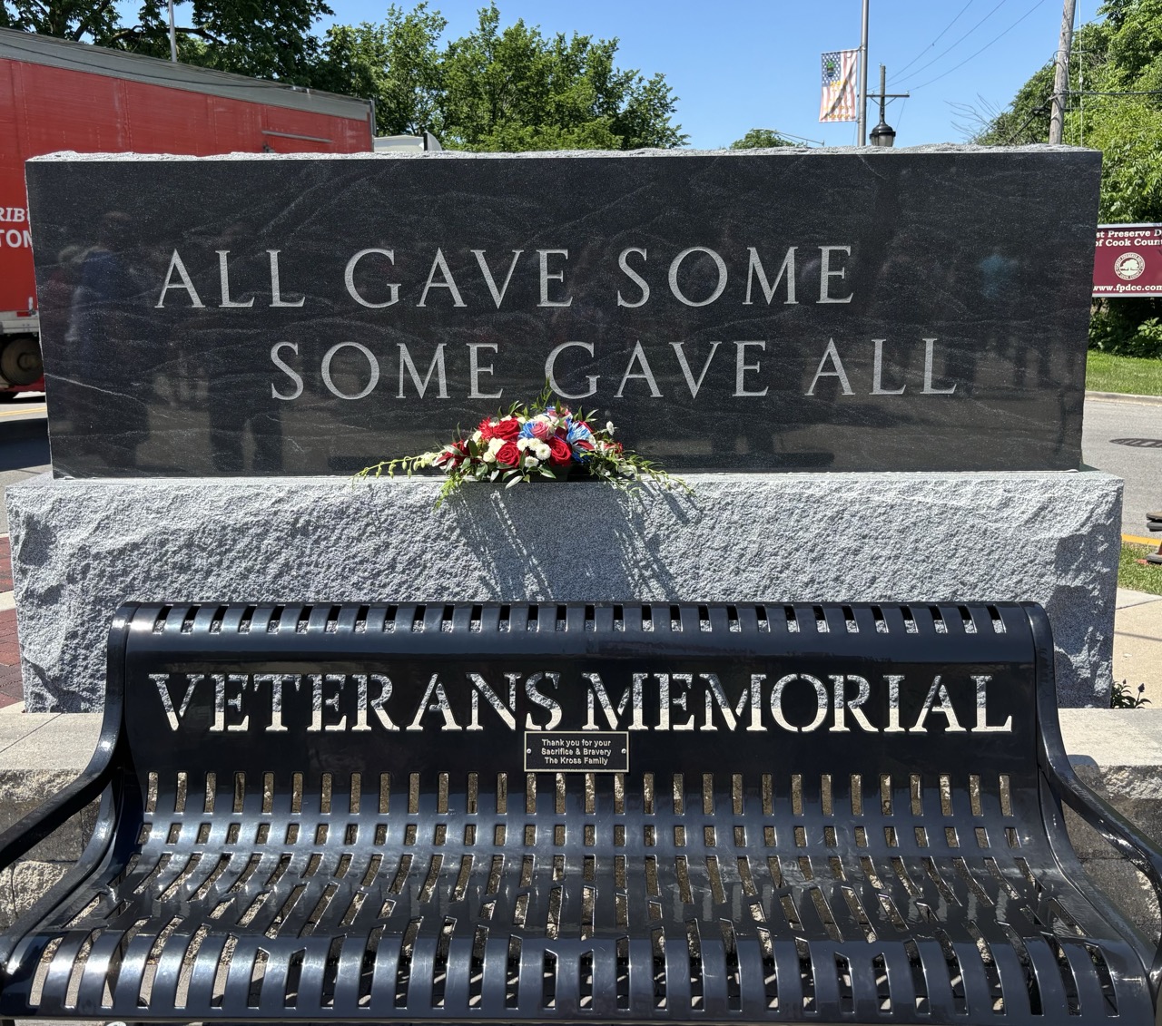 Veterans Memorial bench installation with a stone carved with All Gave Some Some Gave All