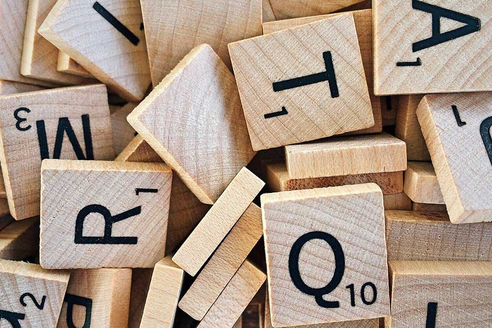 Overhead view of a pile of Scrabble letter tiles.