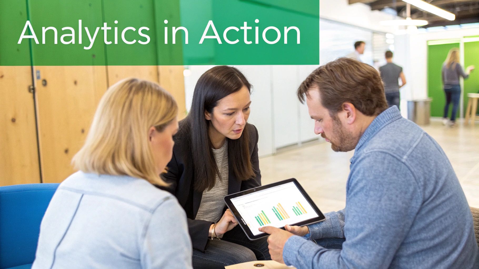 Three business professionals reviewing data analytics and bar charts on a tablet in a modern office.