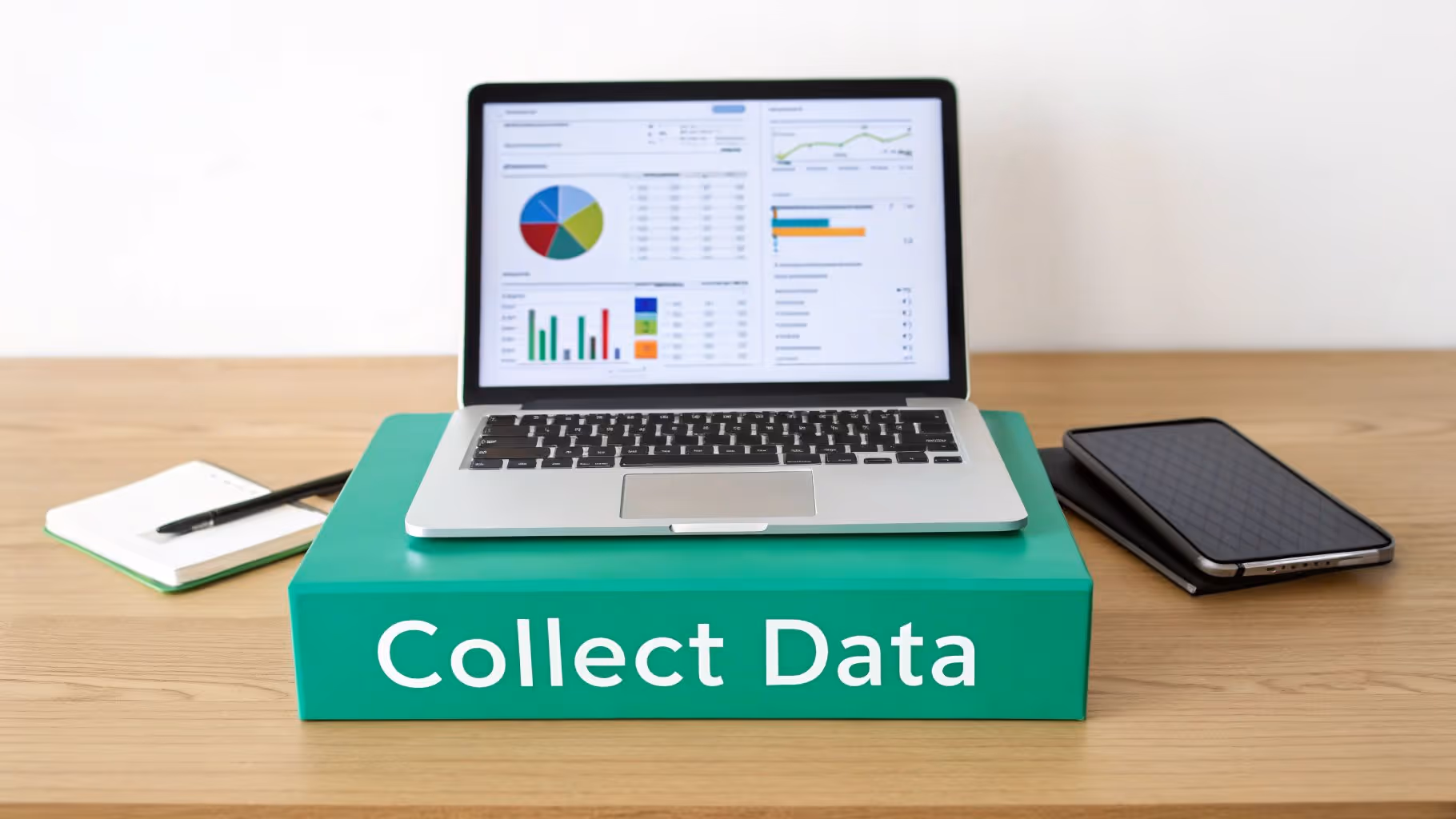 A laptop on a green stand displaying data visualizations, with 'Collect Data' text, next to a notebook and smartphone.