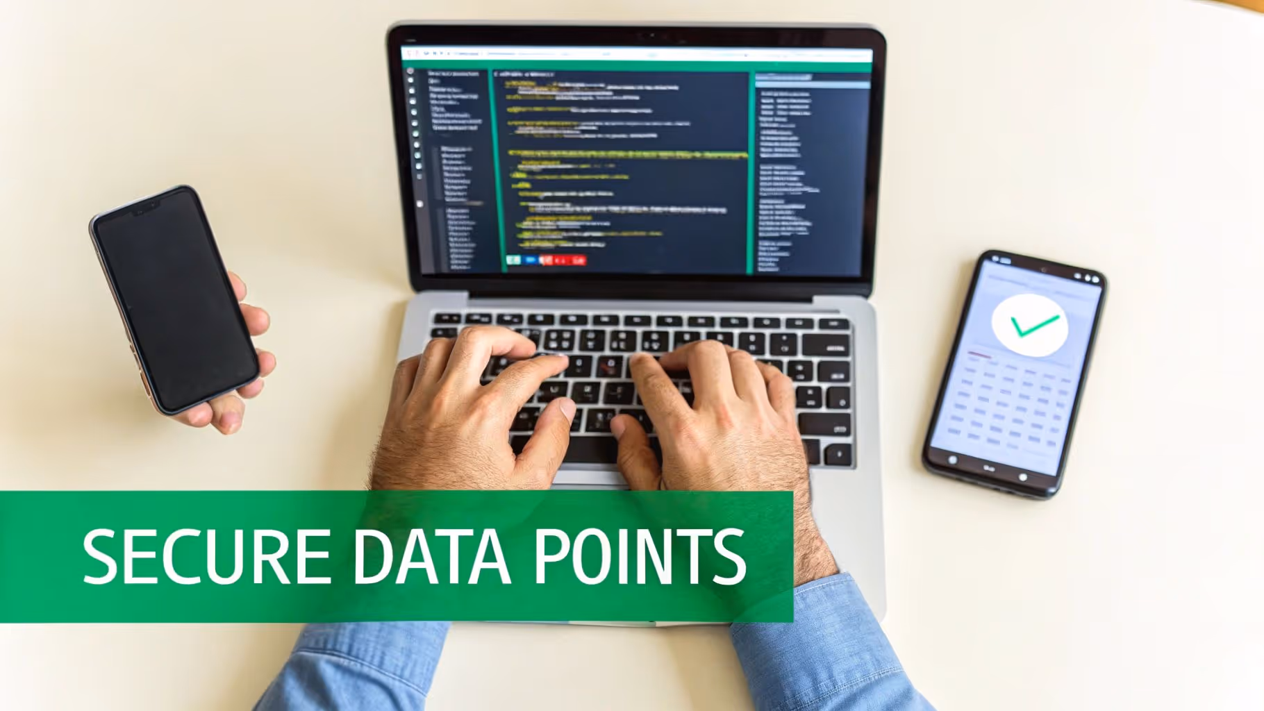 Hands typing code on a laptop, surrounded by two smartphones, illustrating secure data points.