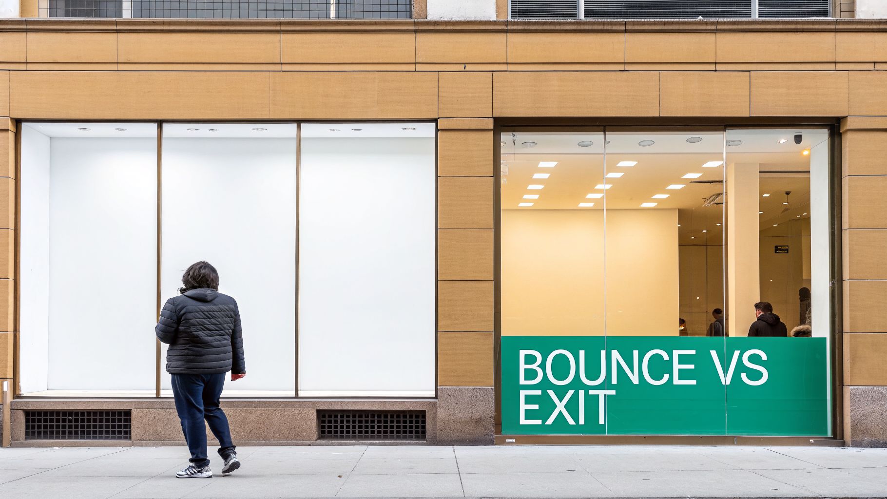 A person walks past a storefront with 'BOUNCE VS EXIT' sign and an empty display.