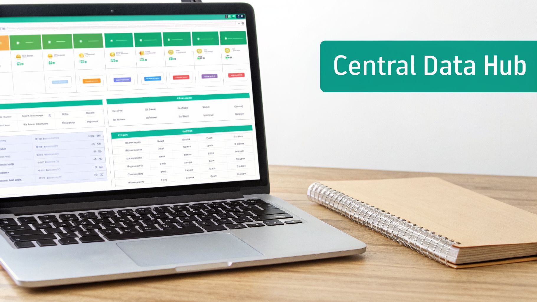 A laptop displaying a data dashboard and a spiral notebook on a wooden desk with 'Central Data Hub' text.